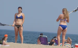 3 girls on the beach in bikinis with big boobs, one brunette and two blondes