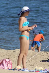 Couple of hot babes hanging out at the beach in bikinis