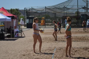Beach volleyball blonde looking sexy and showing her body off