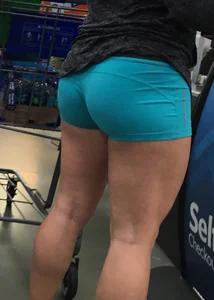 Big booty girl in blue spandex shorts shopping