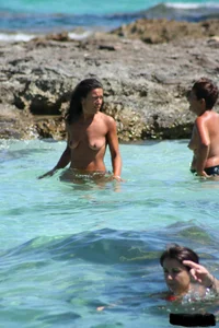 Nude beach ladies in the water showing their tits