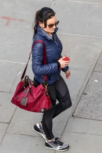 Brunette lady in leggings out walking