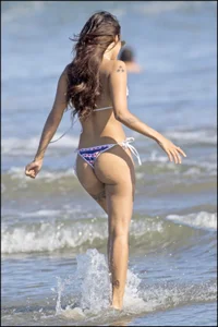 Two sexy ass friends at the beach in thong bikinis