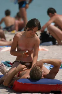 Beach voyeur girls in bikinis, thongs and topless
