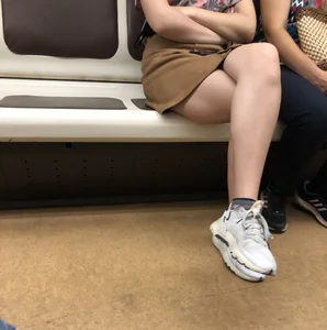 Amazing Hot Girl in a Skirt and Sneakers Sitting Cross-Legged in the Subway Train and on the Escalator Candid Photos Gallery
