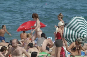 Topless girls on a beach in Barcelona