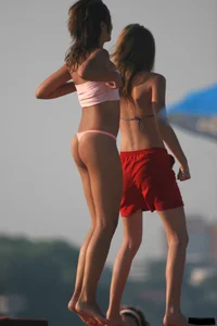 A bunch of sexy beach voyeur babes in bikinis, thongs and topless