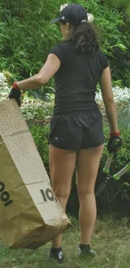 Brunette gardener in shorts bends over… and over as she works [085]