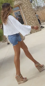 Flat ass leggy girl in denim shorts