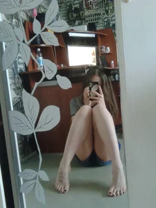 Girl with Hot Legs and Bare Feet Sitting on the Floor Mirror Selfie