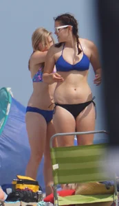 3 girls on the beach in bikinis with big boobs, one brunette and two blondes