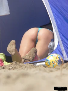 Couple of thick beach teens in little thong bikinis