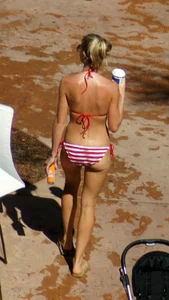 Blonde babe at the pool with sexy body in USA bikini