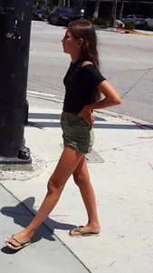 Cute girl wearing shorts and a top at the supermarket