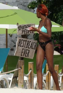 Candid black family, milf and teens on the beach in bikinis