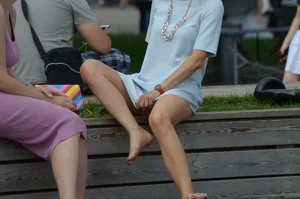 Blonde milf upskirted showing white panties and some pubes