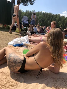 Gorgeous Candid Girl With a Large Tattoo on Her Butt Lying on the Beach Creepshot