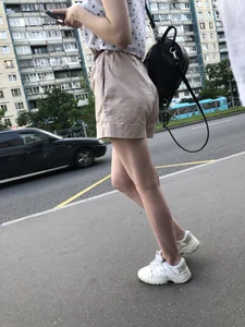 Cute Girl in a Blouse and Shorts With Thin Legs Bus Stop Candid Photo Gallery