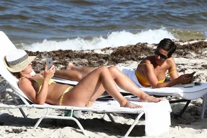 Frankie Bridge nip slips in a bikini on the beach