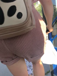 Young Girl in Sandals and Shorts in a Public Bus