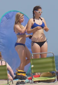 3 girls on the beach in bikinis with big boobs, one brunette and two blondes
