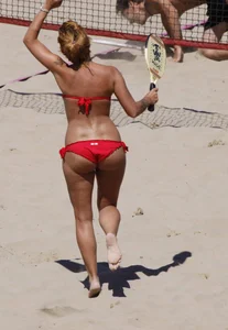 Redhead with nice ass and back dimples in red bikini on the beach