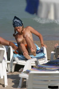 Beach voyeur girls in bikinis, thongs and topless