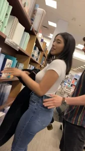 Pretty babe in tight jeans showing nipples in book store w bf (Not OC)(Face shot)