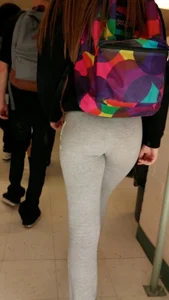 Cute college girl wearing grey leggings