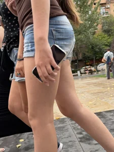 Candid teen wearing denim shorts passing by, nice legs