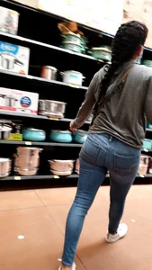 Latina with a bubble butt in tight jeans….