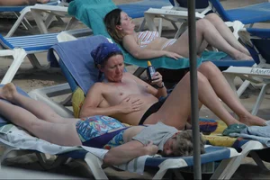 Girls on a nude beach in Sitges, Spain