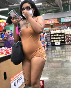 Latina with hard nipples and a big booty in tight spandex shorts outfit