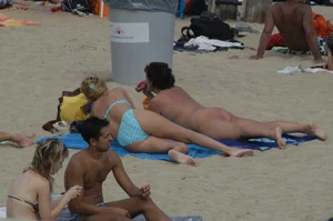 Topless girls on a beach in Barcelona