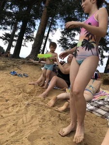 Girls in One-Piece Body Swimsuits Running Towards Water and Swimming - Beach Photo Gallery