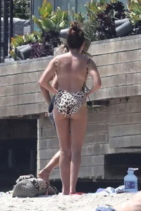 Ashley Tisdale in cheetah print swimsuit on the beach in Malibu