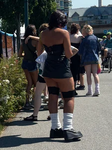 Cheeks hangin’ out of little black skirt