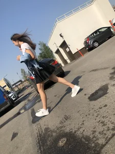 Awesome Candid Girl in a Leather Skirt And Sneakers Walking Down a Street, Then Flashing Her White Panties on the Stairs Creepshots Gallery