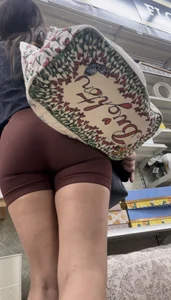 Cute girl in maroon shorts