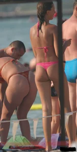 A bunch of sexy beach voyeur babes in bikinis, thongs and topless