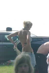 Blonde babe changing into and out of bikini and shows her tits