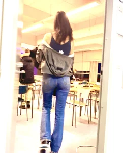 Skinny Candid Teen With Very Slim Long Legs in Blue Jeans Walking into a Classroom
