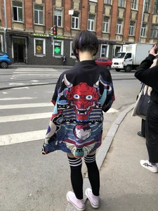 An Anime Fan Teen in a Short Skirt And Stockings Bending Over on the Crosswalk Street Creepshots