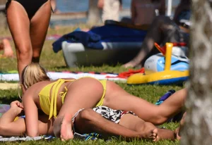 Blonde looking sexy in a yellow bikin