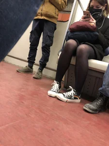 Cute masked candid girl wearing a skirt and black pantyhose, subway train creepshots
