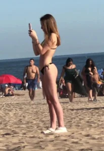 Slim teen in thong bikini