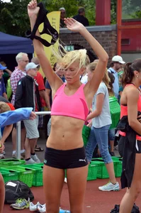 Sexy blonde track sprinter changing after a race