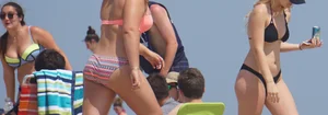 Two thick white girls in bikinis on the beach with big asses