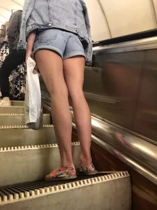 Girl in Blue Denim Shorts and with Hot Long Legs Subway Escalator Creepshot
