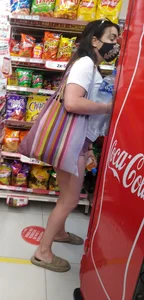 Nice girl, in shorts showing a piece of her peach